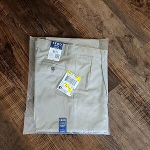 Boys Izod adjustable waist khaki pants. Size 14 Husky. Still sealed in packaging